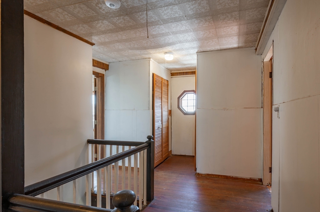 34 Summer Street Saugus, MA 01906 - Photo 30 of 35 a view of a hallway with wooden floor and staircase