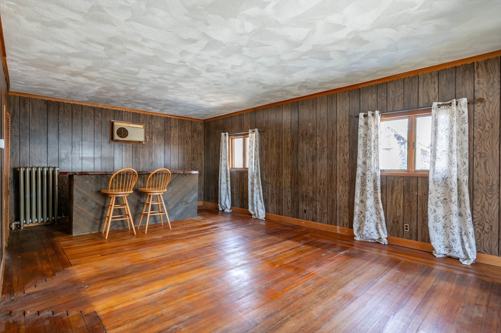 34 Summer Street Saugus, MA 01906 - Photo 9 of 35 an empty room with wooden floor and windows