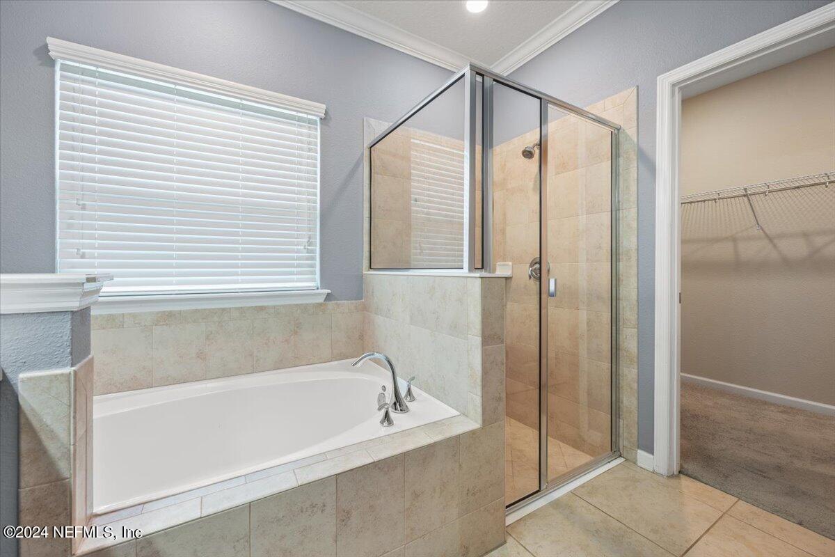 13 Pantano Vista Way St. Augustine, FL 32095 - Photo 17 of 25 a bathroom with a bathtub and a shower