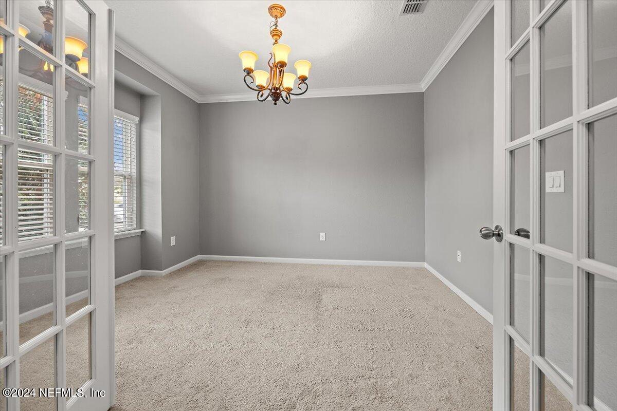 13 Pantano Vista Way St. Augustine, FL 32095 - Photo 25 of 25 a view of an empty room with a window