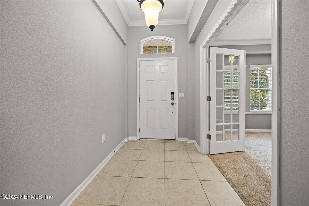 13 Pantano Vista Way St. Augustine, FL 32095 - Photo 6 of 25 a view of a hallway with windows