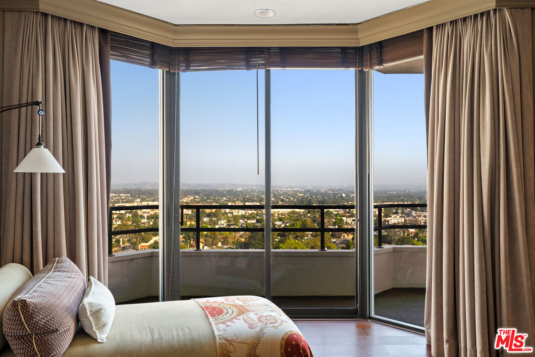 10601 Wilshire Boulevard, Unit 1603 Los Angeles, CA 90024 - Photo 14 of 33 a bedroom with a bed and a window