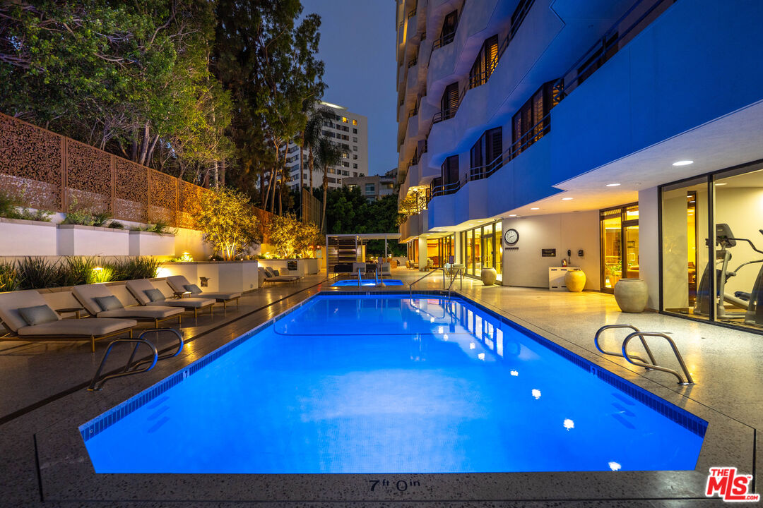 10601 Wilshire Boulevard, Unit 1603 Los Angeles, CA 90024 - Photo 22 of 33 a view of a swimming pool with seating area