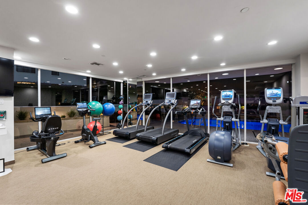 10601 Wilshire Boulevard, Unit 1603 Los Angeles, CA 90024 - Photo 27 of 33 a view of a room with gym equipment