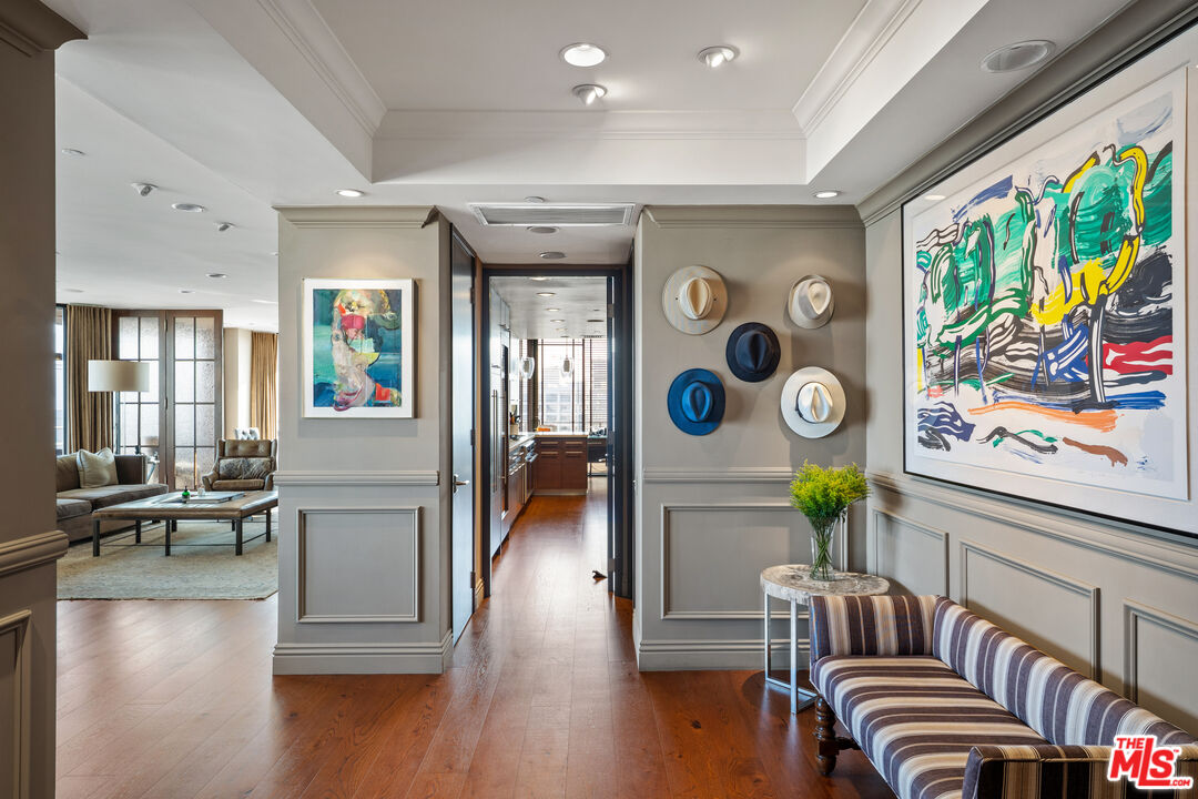 10601 Wilshire Boulevard, Unit 1603 Los Angeles, CA 90024 - Photo 4 of 33 a living room with furniture and a wooden floor