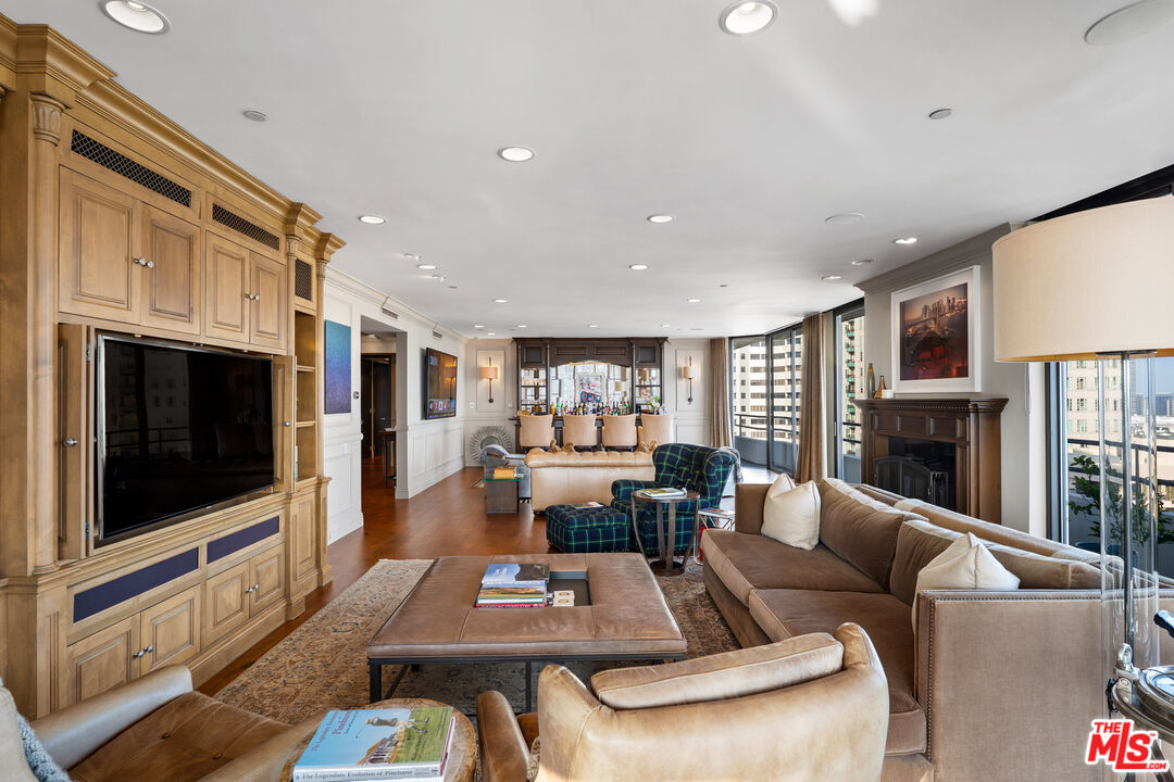 10601 Wilshire Boulevard, Unit 1603 Los Angeles, CA 90024 - Photo 7 of 33 a living room with furniture fireplace and flat screen tv