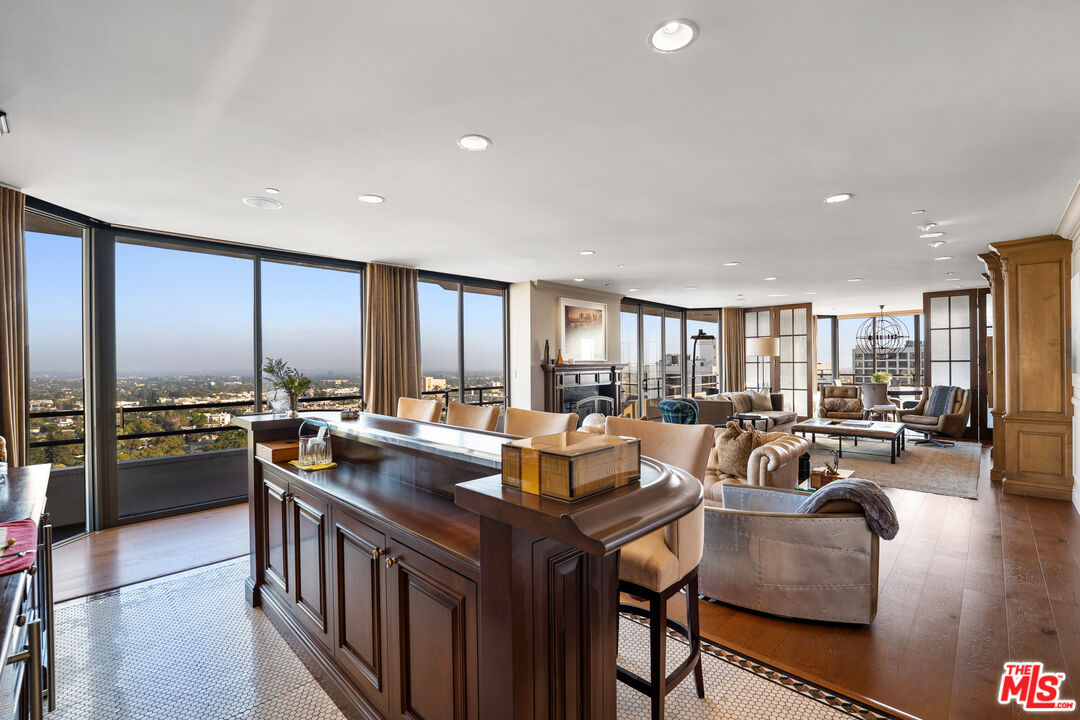 10601 Wilshire Boulevard, Unit 1603 Los Angeles, CA 90024 - Photo 9 of 33 a view of a dining room with furniture window and wooden floor