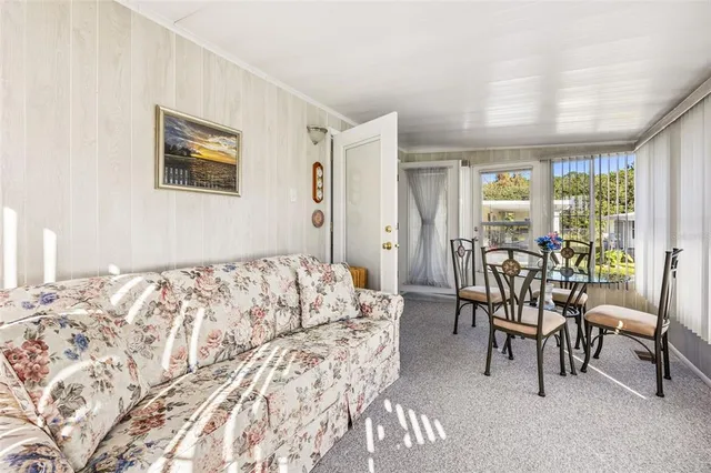 a bedroom with a bed and a table