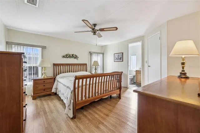 a bed room with a bed and a chandelier
