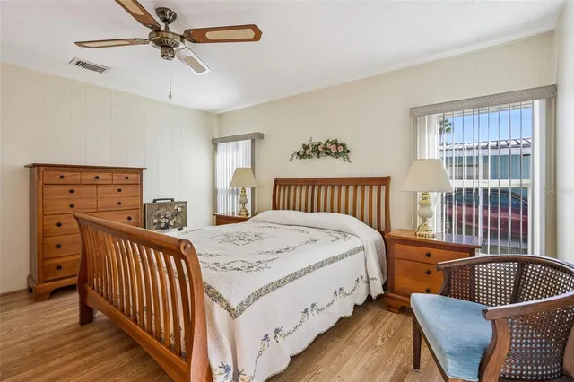 a bedroom with furniture and a window