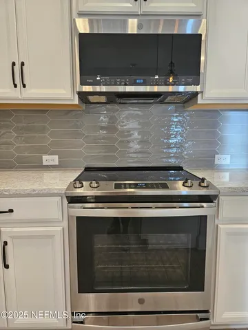 a view of closet area with empty racks