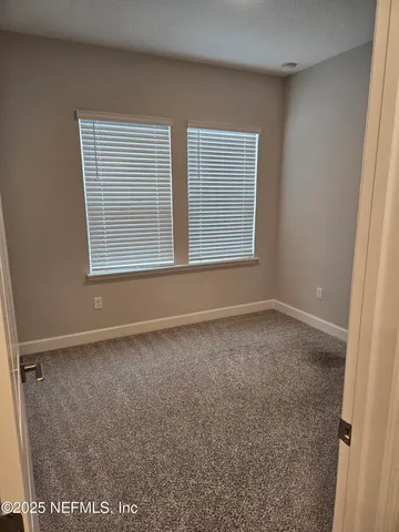 a bathroom with a toilet a sink and shower