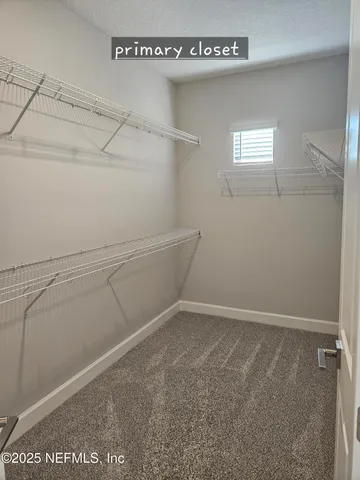 a view of swimming pool with outdoor seating and plants