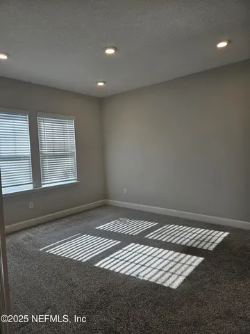 a view of swimming pool with outdoor seating