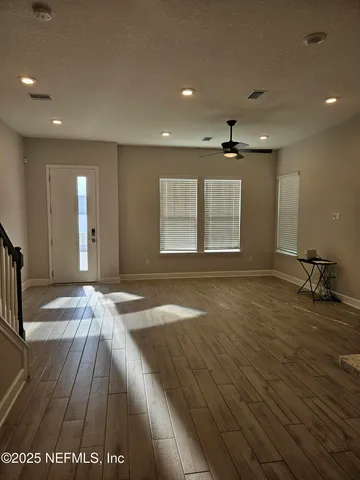a kitchen with stainless steel appliances granite countertop a sink and a white cabinets