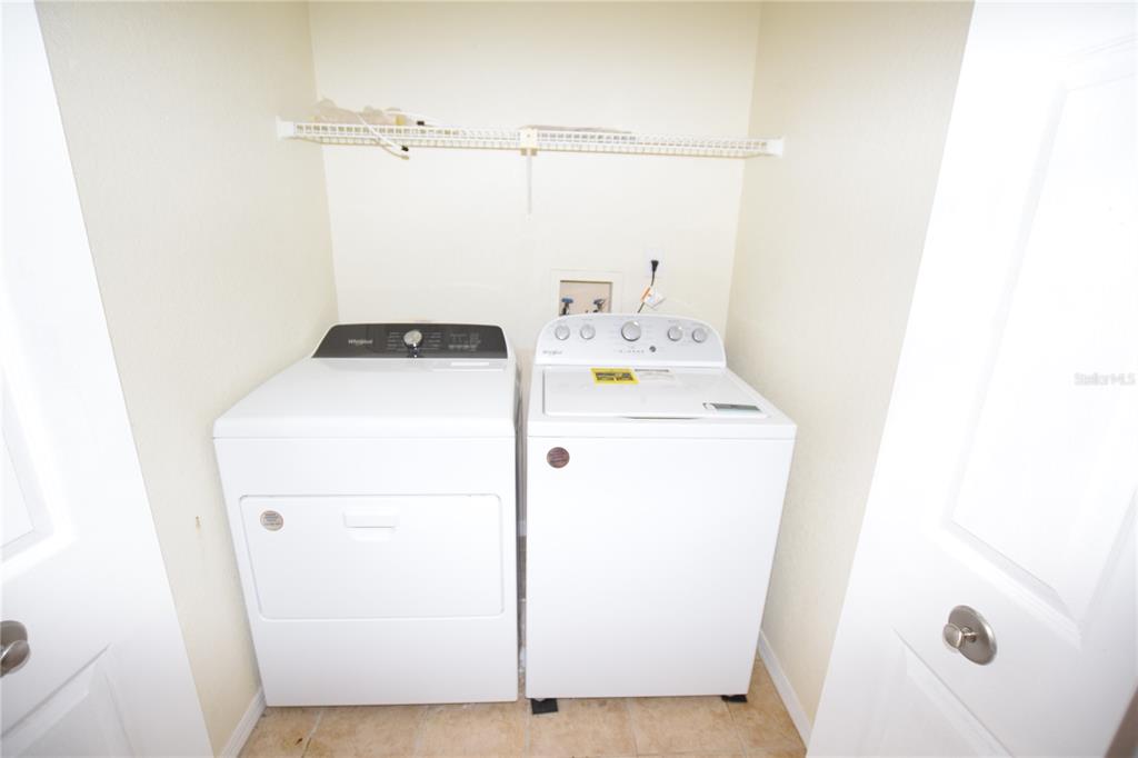 5120 Conroy Road, Unit 511 Orlando, FL 32811 - Photo 21 of 32 a utility room with dryer and washer