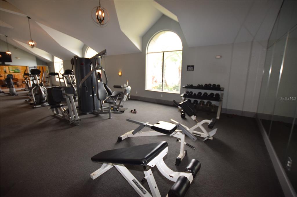 5120 Conroy Road, Unit 511 Orlando, FL 32811 - Photo 22 of 32 a view of a room with gym equipment