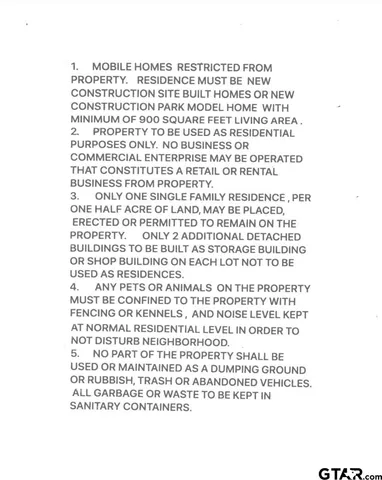 a view of a yard with trees