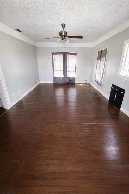 405 West Elm Street Olney, TX 76374 - Photo 2 of 13 a view of workspace with wooden floor and window