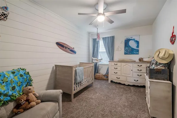 a bedroom with furniture and a window