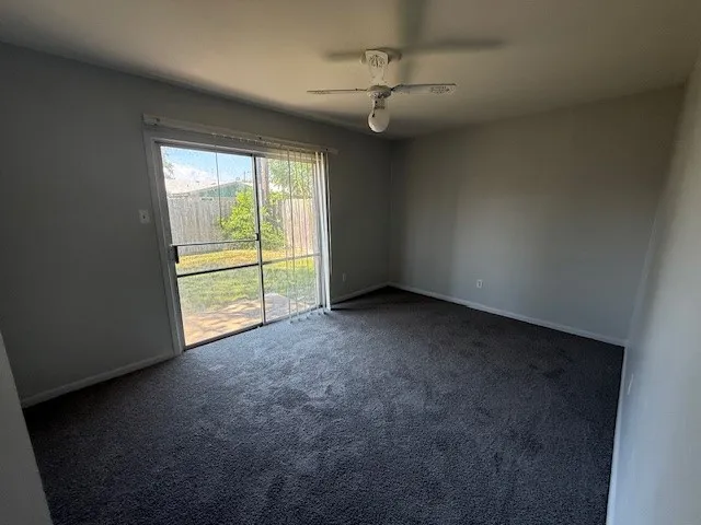 an empty room with a empty space and windows