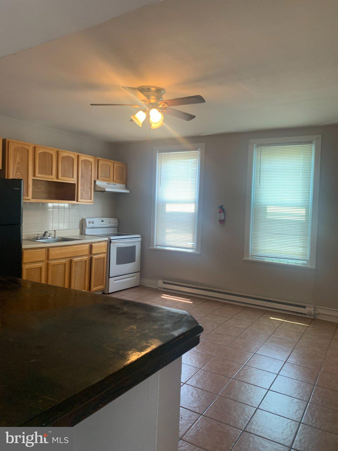 Open concept kitchen from living room view.