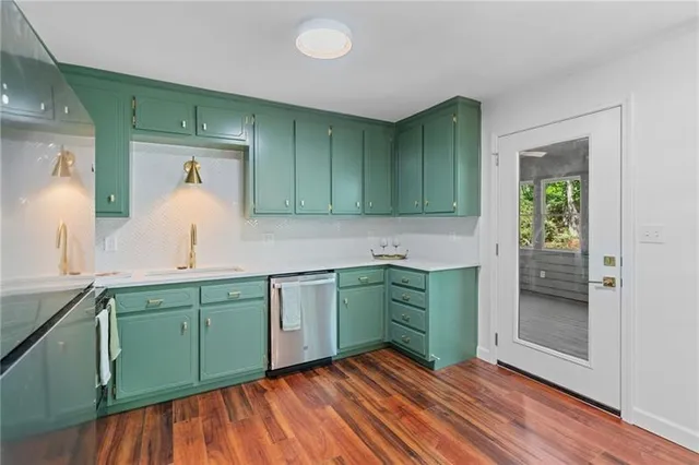 a kitchen with sink and cabinets