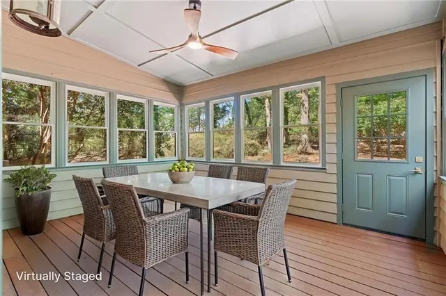 a view of a dining room with furniture window and outside view