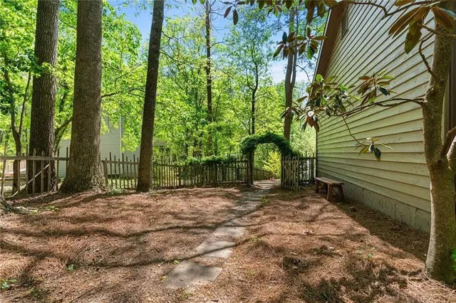 a view of a glass door with a tree in front of it