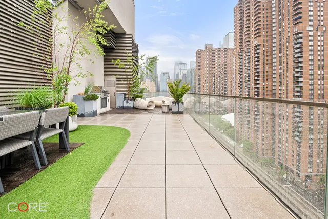 a lobby with furniture and next to a yard