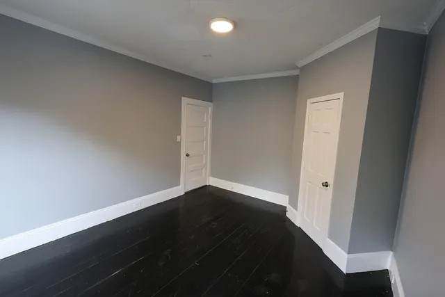 a view of balcony with wooden floor and fence