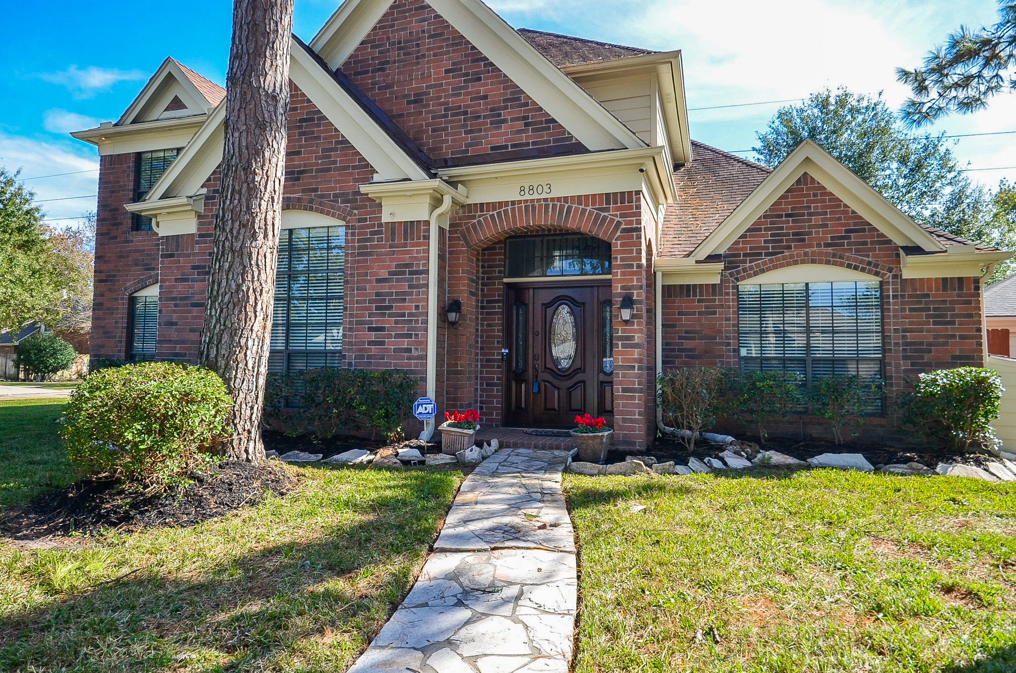 8803 Tweedbrook Drive Spring, TX 77379 - Photo 3 of 36 Notice the gorgeous brick design and a stone walkway that leads to the covered porch.
