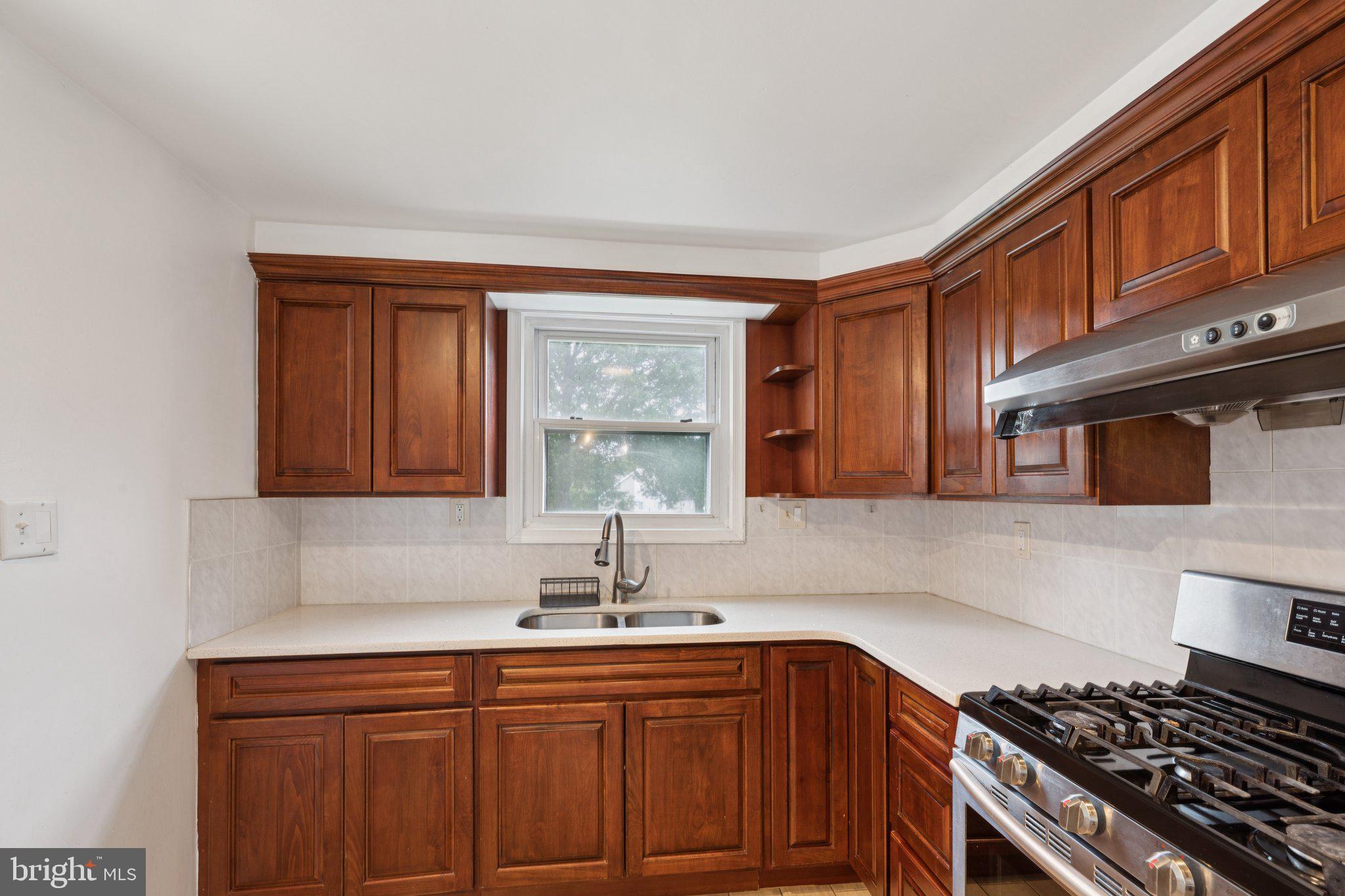 730 Millwood Road Philadelphia, PA 19115 - Photo 16 of 52 a kitchen with stainless steel appliances granite countertop a sink stove and cabinets