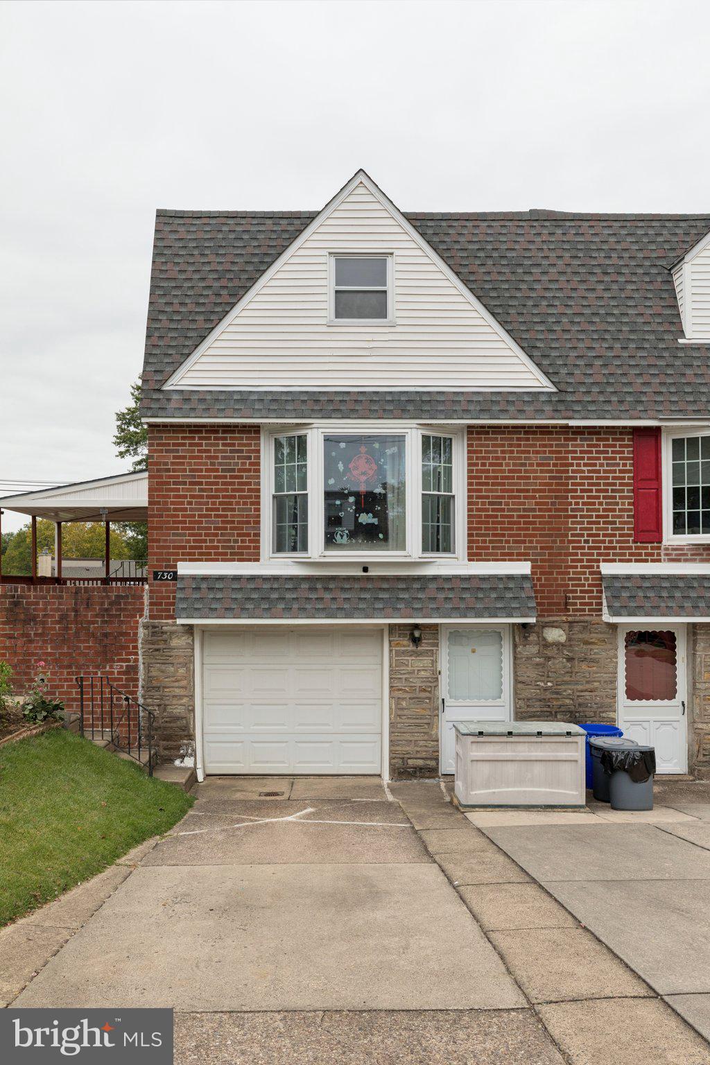 730 Millwood Road Philadelphia, PA 19115 - Photo 3 of 52 a front view of a house with a yard and garage