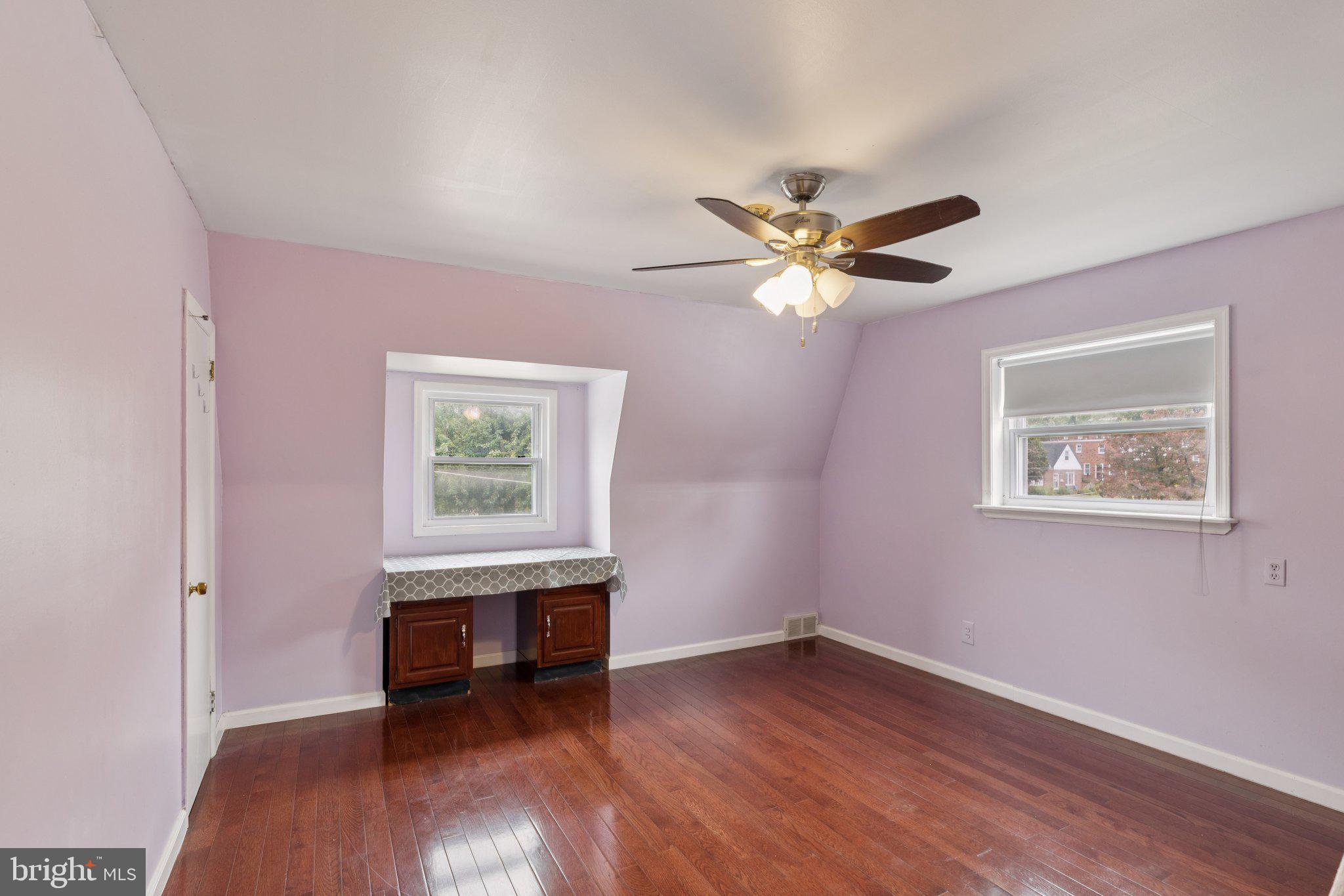730 Millwood Road Philadelphia, PA 19115 - Photo 40 of 52 a workspace with wooden floor and a ceiling fan