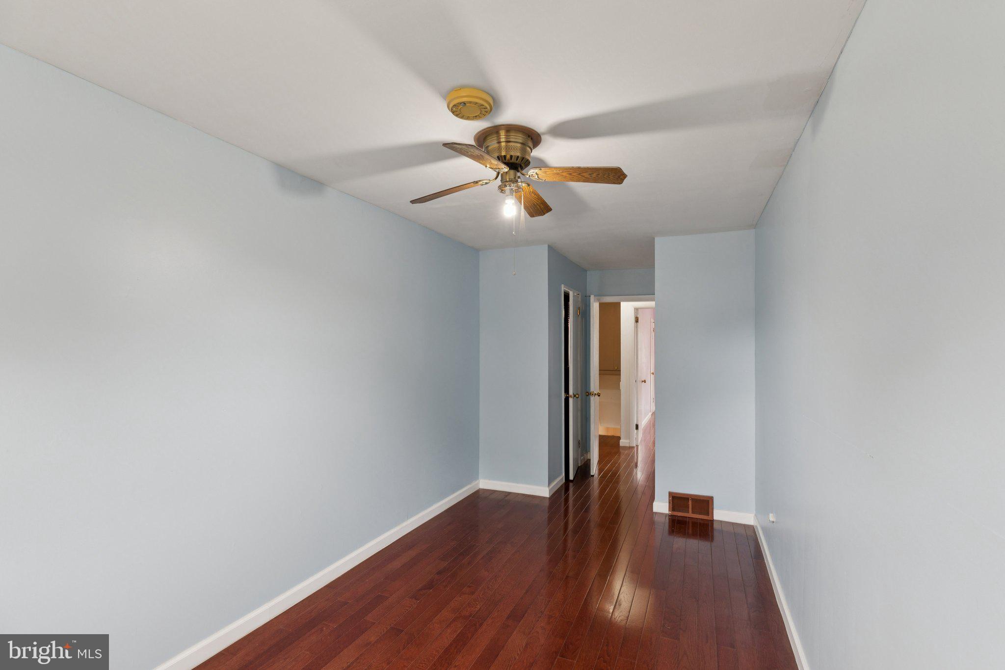 730 Millwood Road Philadelphia, PA 19115 - Photo 45 of 52 a view of an empty room with window and wooden floor