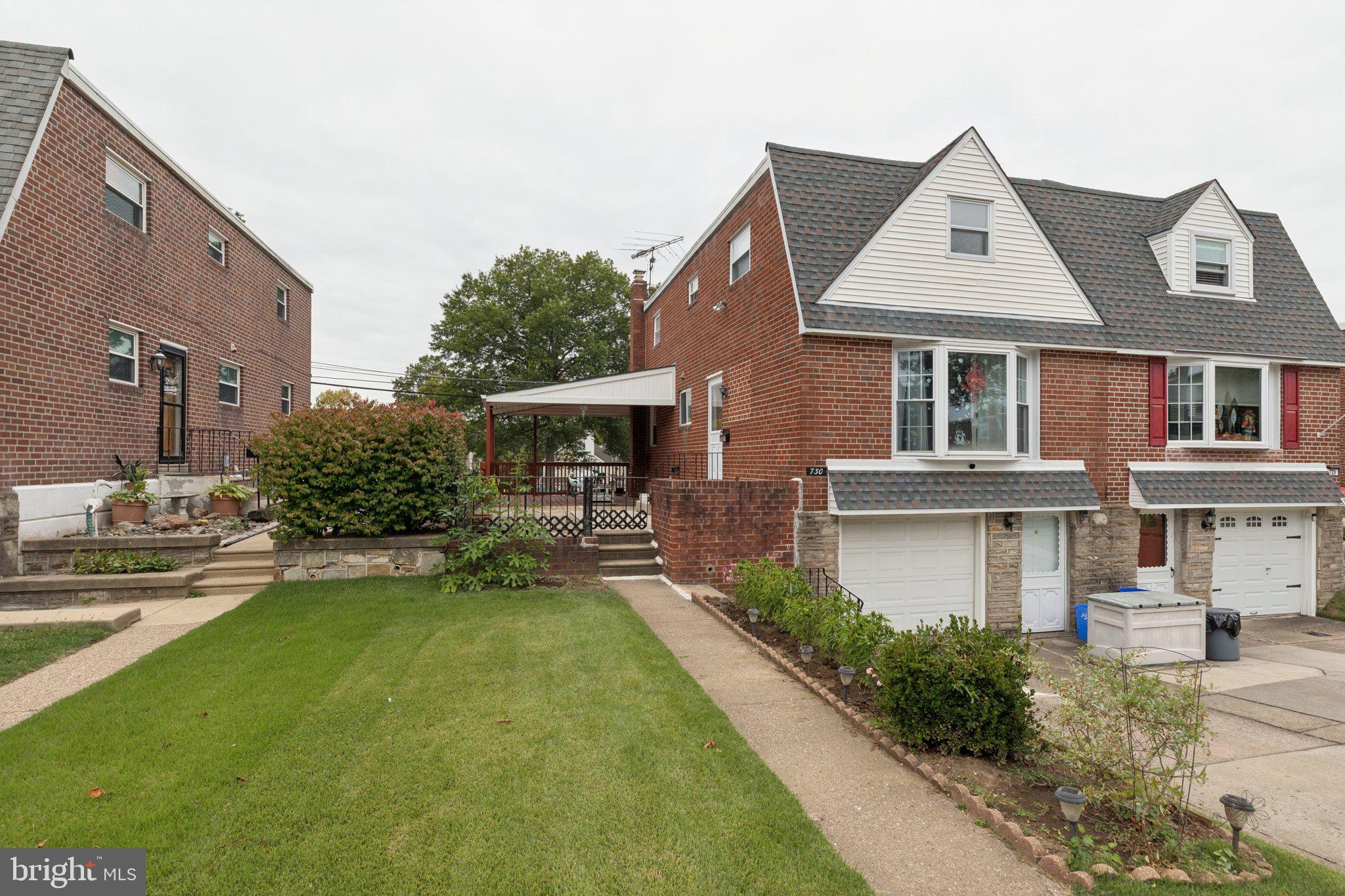 730 Millwood Road Philadelphia, PA 19115 - Photo 5 of 52 a front view of a house with a yard