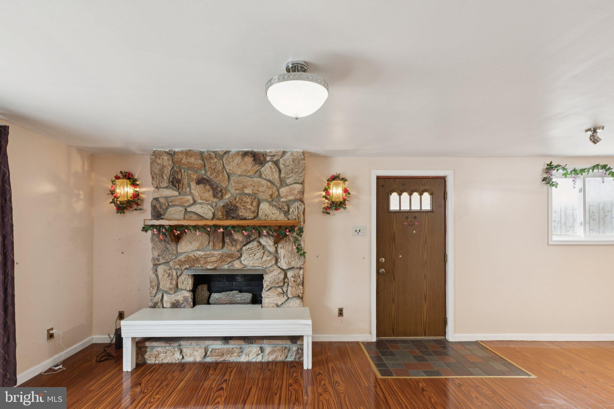 730 Millwood Road Philadelphia, PA 19115 - Photo 8 of 52 a living room with furniture and a fireplace