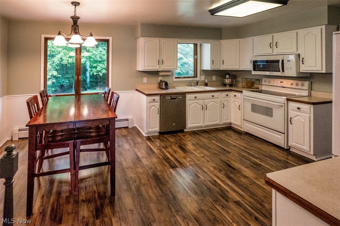 Beautiful updated kitchen equipped with range, microwave oven, and dishwasher