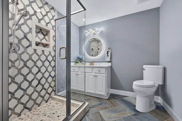 a bathroom with a toilet and a sink