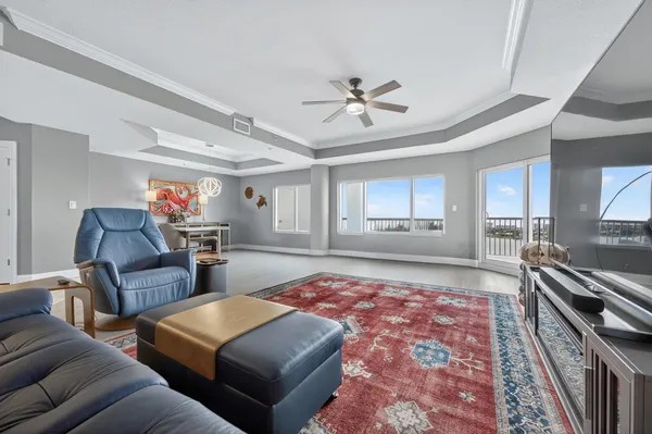 a living room with furniture and a rug