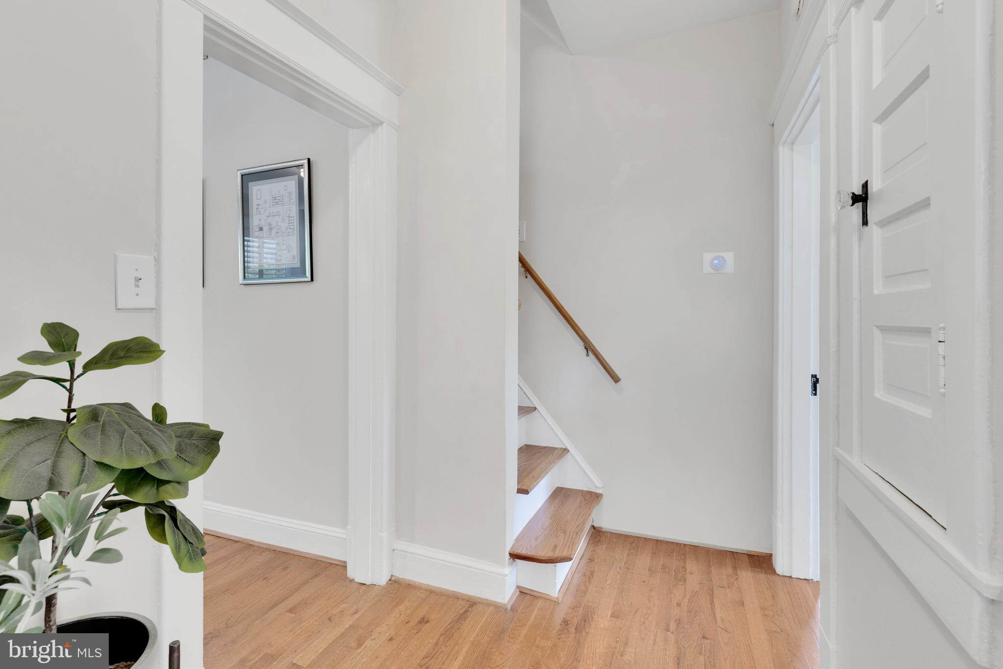 1507 Irving Street Northeast Washington, DC 20017 - Photo 19 of 61 Main floor foyer leads to primary suite upstairs.
