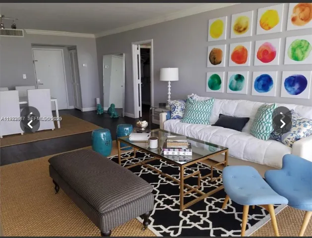 a living room with furniture and a lamp