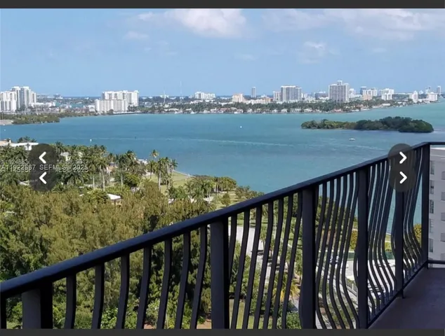 a view of a balcony with an ocean