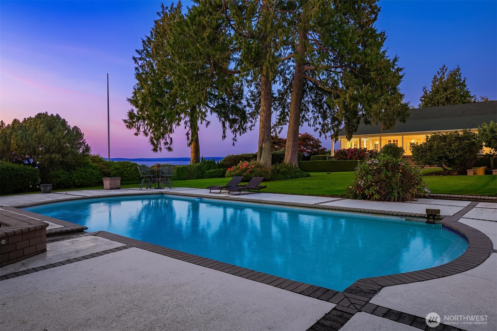 3727 Shore Avenue Everett, WA 98203 - Photo 12 of 40 a view of a swimming pool and trees in the background