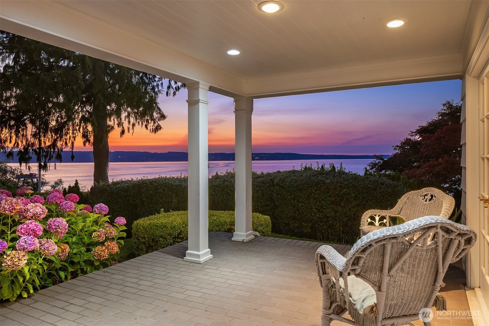 3727 Shore Avenue Everett, WA 98203 - Photo 16 of 40 a front view of a house with a garden and balcony