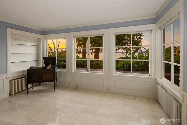 a living room with furniture and windows