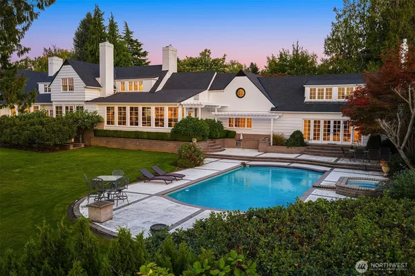 an aerial view of house with yard swimming pool and outdoor seating