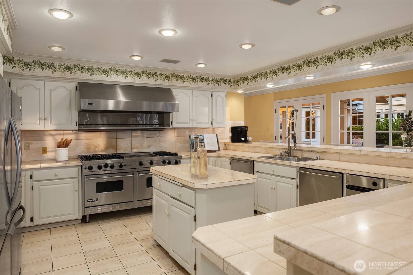 3727 Shore Avenue Everett, WA 98203 - Photo 24 of 40 a kitchen with a sink stainless steel appliances and cabinets