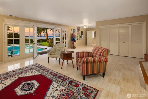 a living room with furniture and a rug